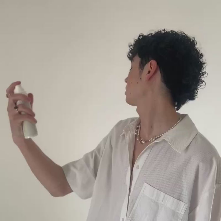 Man spraying Stay Clear Beauty Tiger Grass Relentless Hydration Toner directly onto face, demonstrating how to apply for instant hydration and barrier support