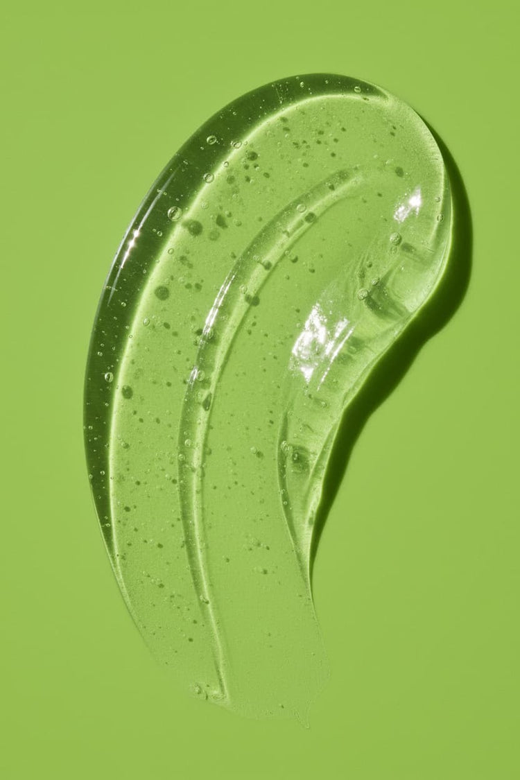 Stay Clear Beauty Flawless Start Gel Cleanser gel texture swatch on an aloe green background — highlighting the lightweight, low-suds formula of this sulfate-free cleanser for sensitive skin, acne-prone skin, redness, and skin barrier repair.
