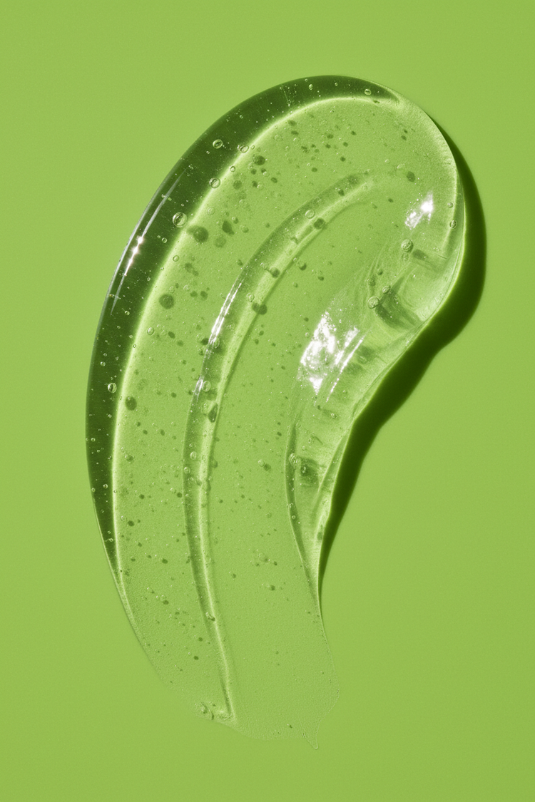 Stay Clear Beauty Flawless Start Gel Cleanser gel texture swatch on an aloe green background — highlighting the lightweight, low-suds formula of this sulfate-free cleanser for sensitive skin, acne-prone skin, redness, and skin barrier repair.

