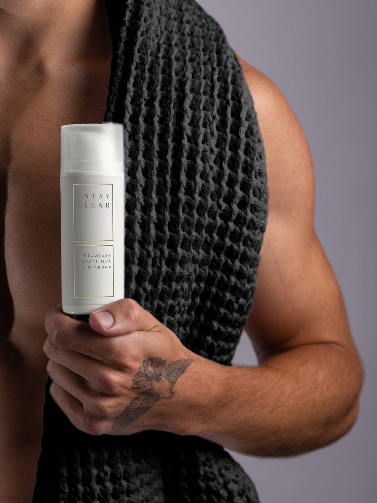 Man holding Stay Clear Beauty Flawless Start Gel Cleanser emphasizing its gentle yet effective formula — sulfate-free gel cleanser for sensitive skin, acne-prone skin, skin barrier repair, and irritation relief.
