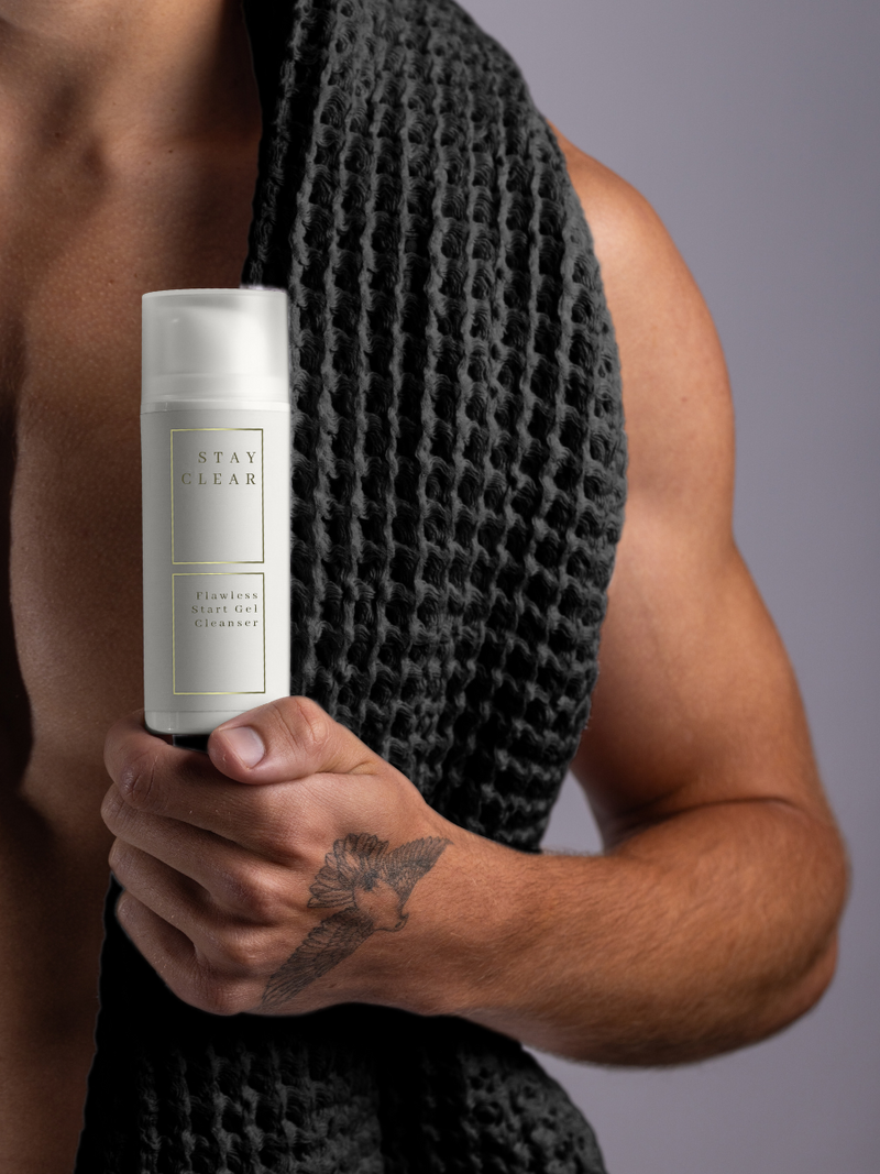 Man holding Stay Clear Beauty Flawless Start Gel Cleanser emphasizing its gentle yet effective formula — sulfate-free gel cleanser for sensitive skin, acne-prone skin, skin barrier repair, and irritation relief.
