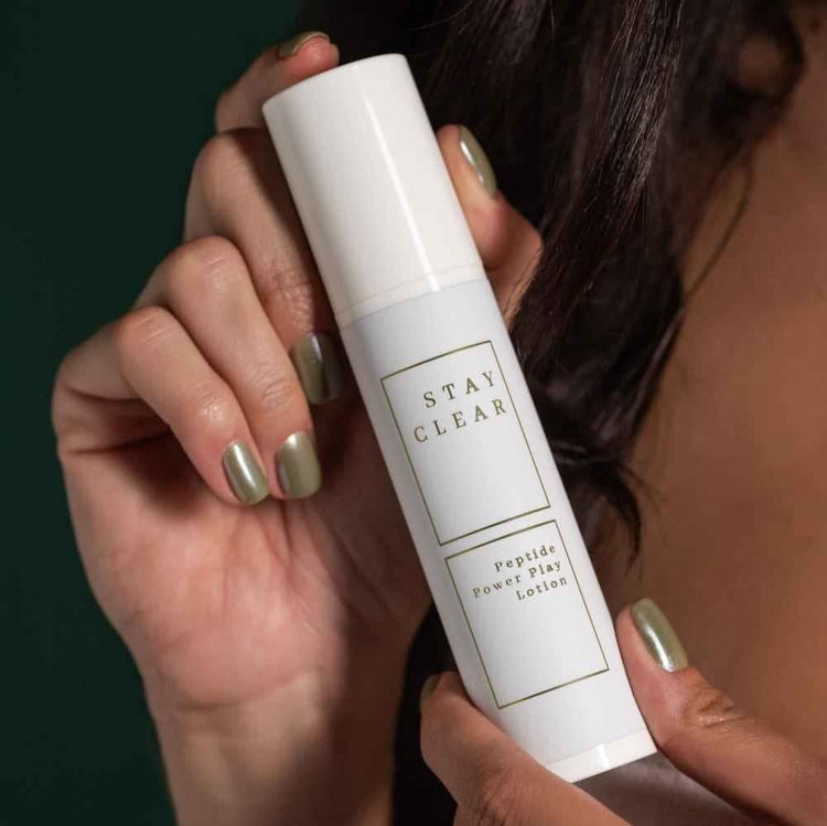 Stay Clear Beauty Peptide Power Play Lotion — woman holding bottle, copper peptide moisturizer for skin firmness, fine lines, and anti-aging

