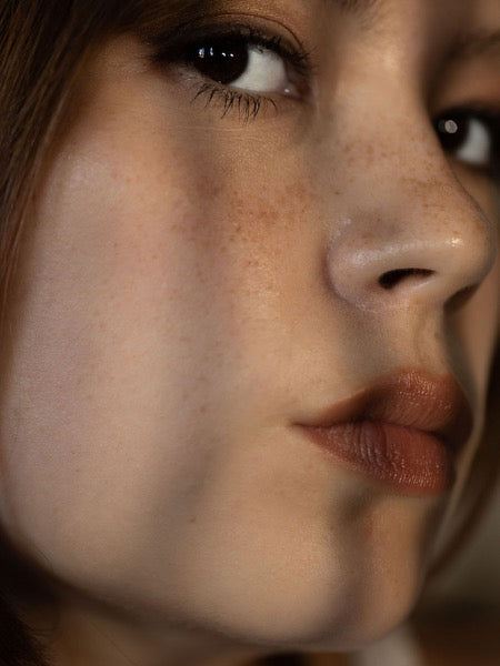 Close-up of a woman with clear, even-toned skin after using Stay Clear Beauty Super Serum Even Tone &amp; Glow — mandelic acid serum for dark spots, post-acne marks, uneven skin tone, and sensitive acne-prone skin.