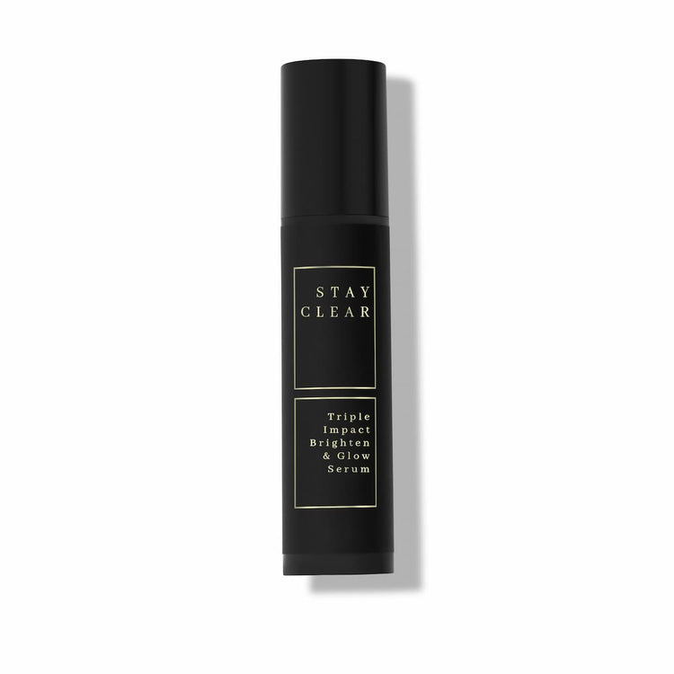 Stay Clear Beauty Triple Impact Brighten & Glow Serum dark airless pump bottle on neutral background — clinical brightening serum for dark spots, age spots, post-acne marks, hyperpigmentation, and uneven skin tone.