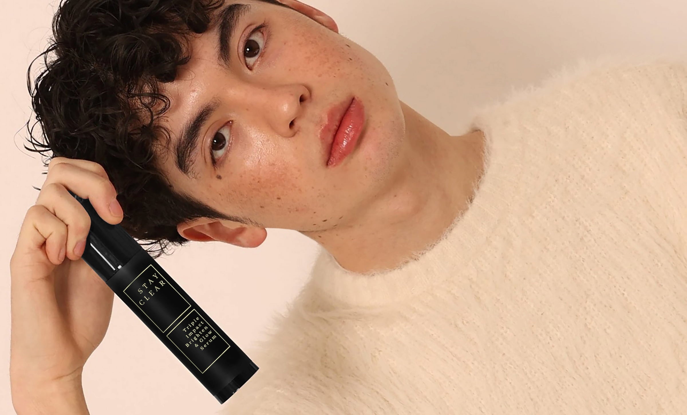 Stay Clear Beauty Triple Impact Brighten & Glow Serum — man holding bottle, hyperpigmentation dark spot treatment for acne-prone skin