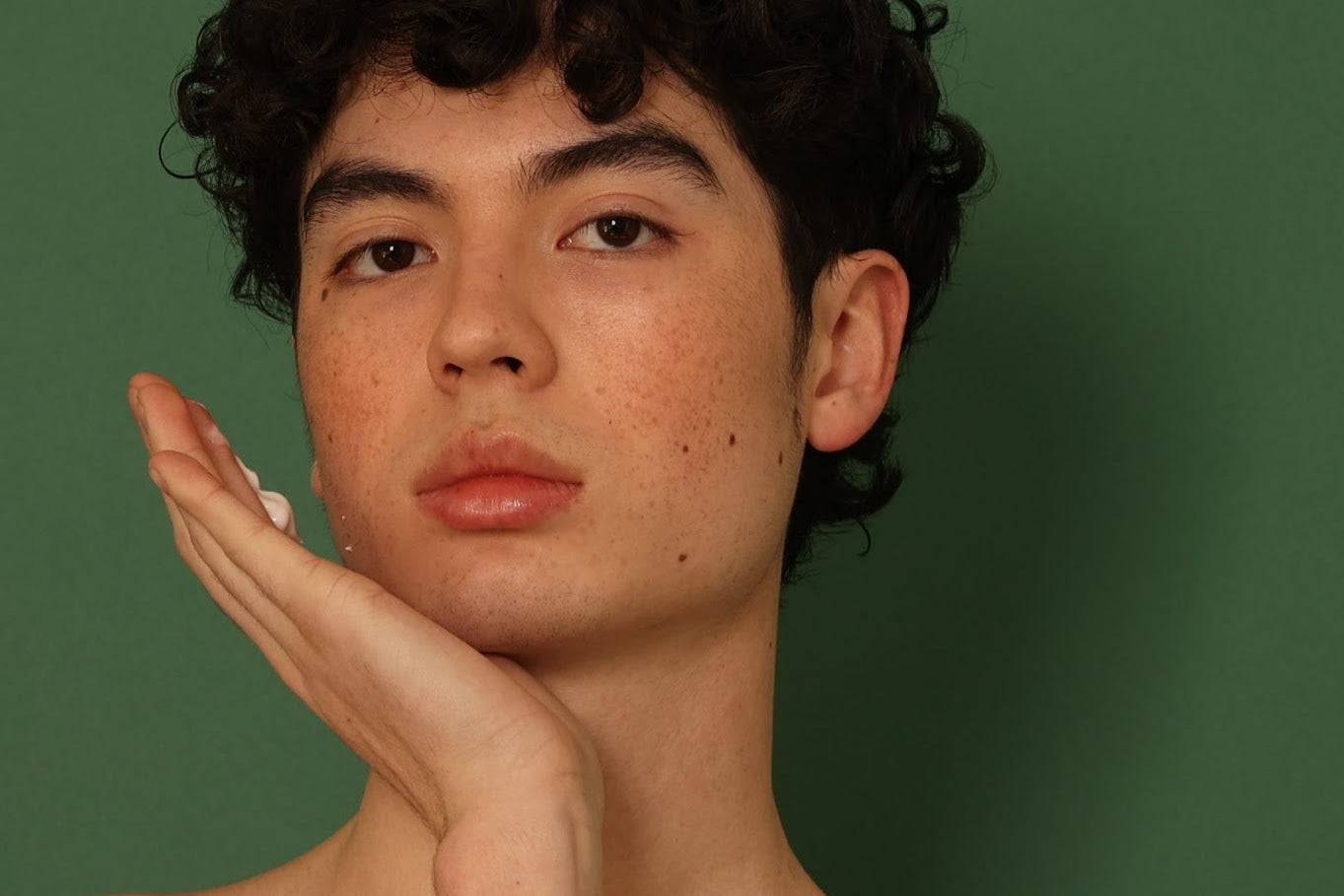 A man applying Stay Clear cleanser to his face, demonstrating proper skincare techniques for a clear and refreshed complexion.