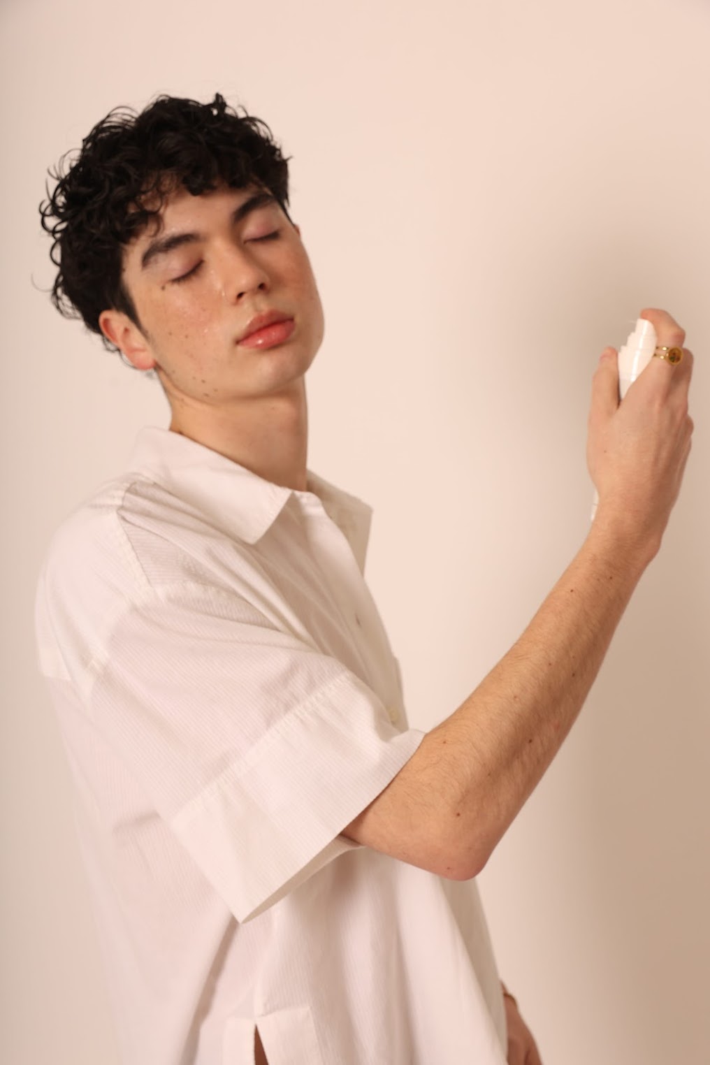 A man refreshing his skin with Stay Clear toner, demonstrating its hydrating and soothing benefits for dry, sensitive skin in extreme climates.